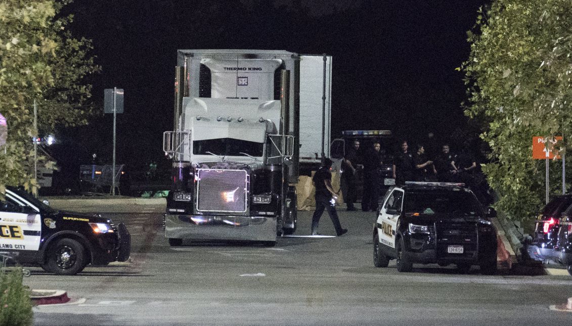 Officials investigate a truck that was found to contain 38 suspected illegal immigrants in San Antonio, Texas, USA, 23 July 2017. EPA/DARREN ABATE