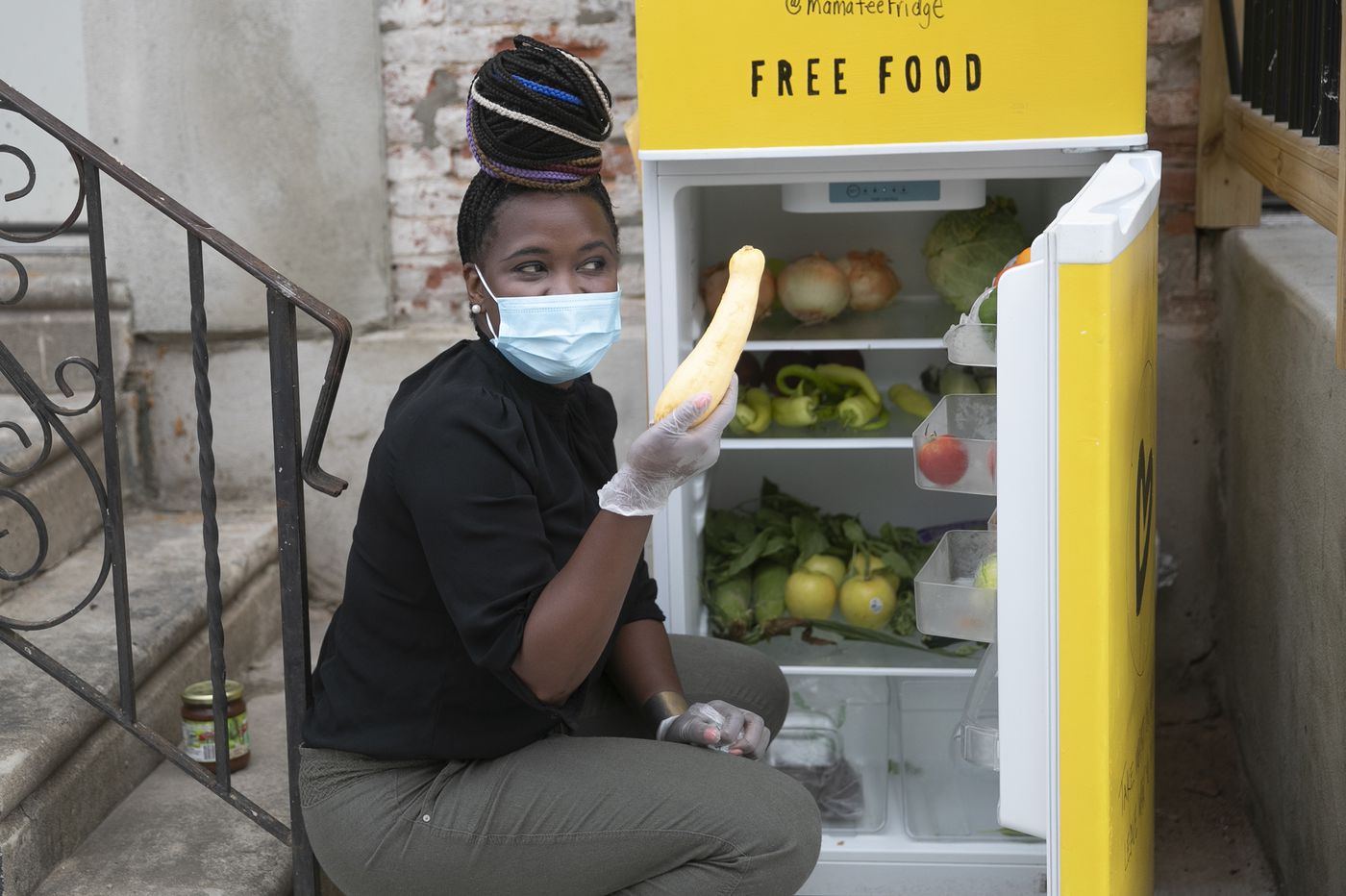 Michelle Nelson in front of Mama-Tee Community Fridge. Photo: Heather Khalifa