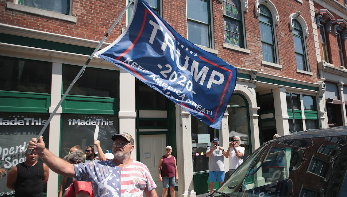 DAYTON, OHIO - AUGUST 07: A supporter of President Donald Trump demonstrates in the Oregon District, where a mass shooting early Sunday morning left nine dead and 27 wounded, on August 07, 2019 in Dayton, Ohio. (Photo by Scott Olson/Getty Images)