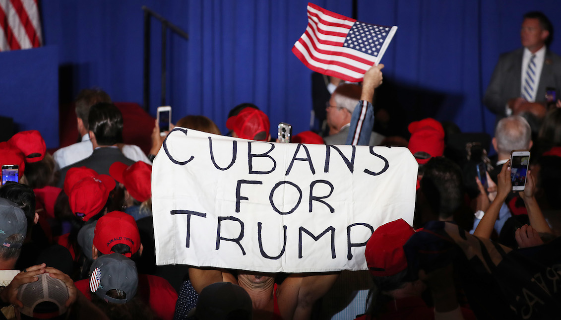 MIAMI, FLORIDA - JUNE 25: People attend a rally for Vice President Mike Pence as he speaks during the Donald J. Trump for President Latino Coalition Rollout at the DoubleTree by Hilton Hotel Miami Airport & Convention Center on June 25, 2019 in Miami, Florida. The Trump campaign is making an effort to engage Latino voters ahead of the 2020 election. (Photo by Joe Raedle/Getty Images)