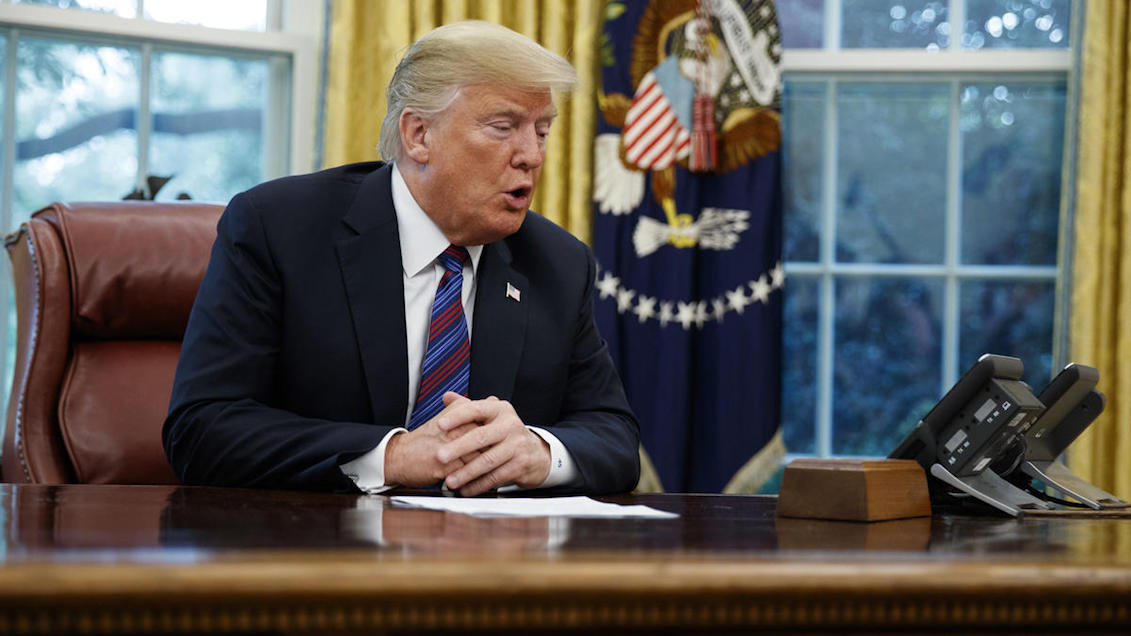 President Donald Trump speaks by phone with Mexican President Enrique Peña Nieto, in the White House Oval Office, on Monday, August 27, 2018, in Washington. Trump announced a commercial "understanding" with Mexico that could lead to a revision of the North American Free Trade Agreement. Evan Vucci / AP