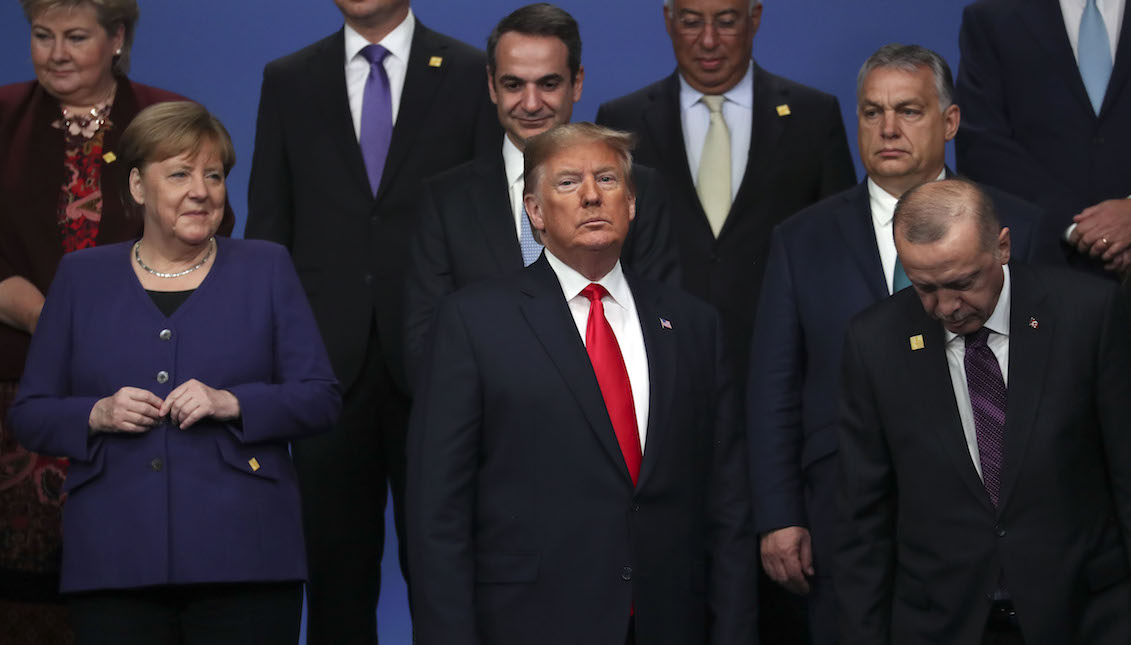 HERTFORD, ENGLAND - DECEMBER 04: Chancellor of Germany Angela Merkel and US President Donald Trump stand onstage during the annual NATO heads of government summit on December 4, 2019 in Watford, England. (Photo by Steve Parsons-WPA Pool/Getty Images)