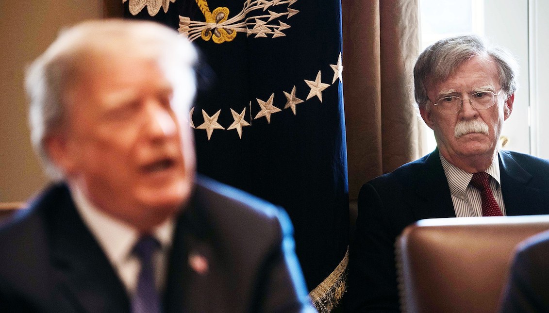 Stock Photo: John Bolton listens to the President of the United States, Donald Trump, speak during a cabinet meeting at the White House in Washington on April 9, 2018. By Nicholas Kamm/AFP/Getty Images.