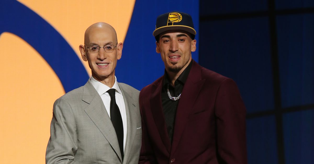 Chris Duarte (right) poses for a photo with NBA Commissioner Adam Silver after being selected as the 13th overall pick by the Indiana Pacers during the NBA basketball draft, Thursday, July 29, 2021, in New York. Photo: Brad Penner-USA TODAY Sports.