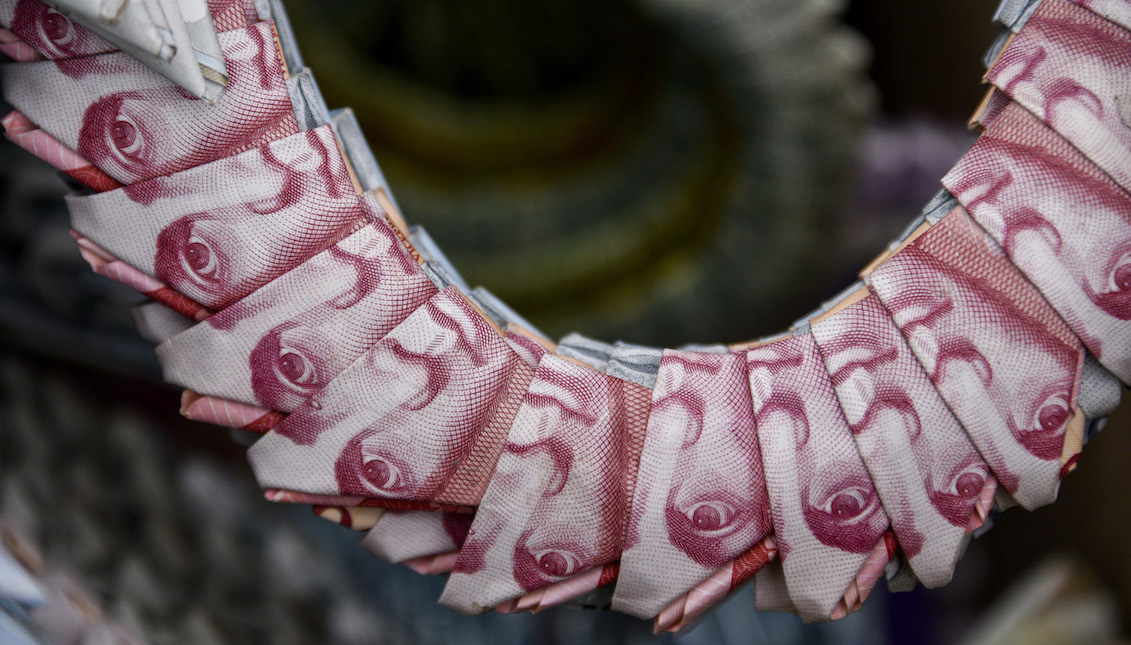 BOGOTA, COLOMBIA - MAY 18: Detail of a swan handicraft made with Venezuelan devalued and out of circulation banknotes Bolivares Fuertes exhibited for sale by Colombian designer Luis Orlando Ortega (out of frame) at the main avenue of historic downtown Bogota, Colombia, on May 18, 2019. (Photo by Guillermo Legaria/Getty Images.)