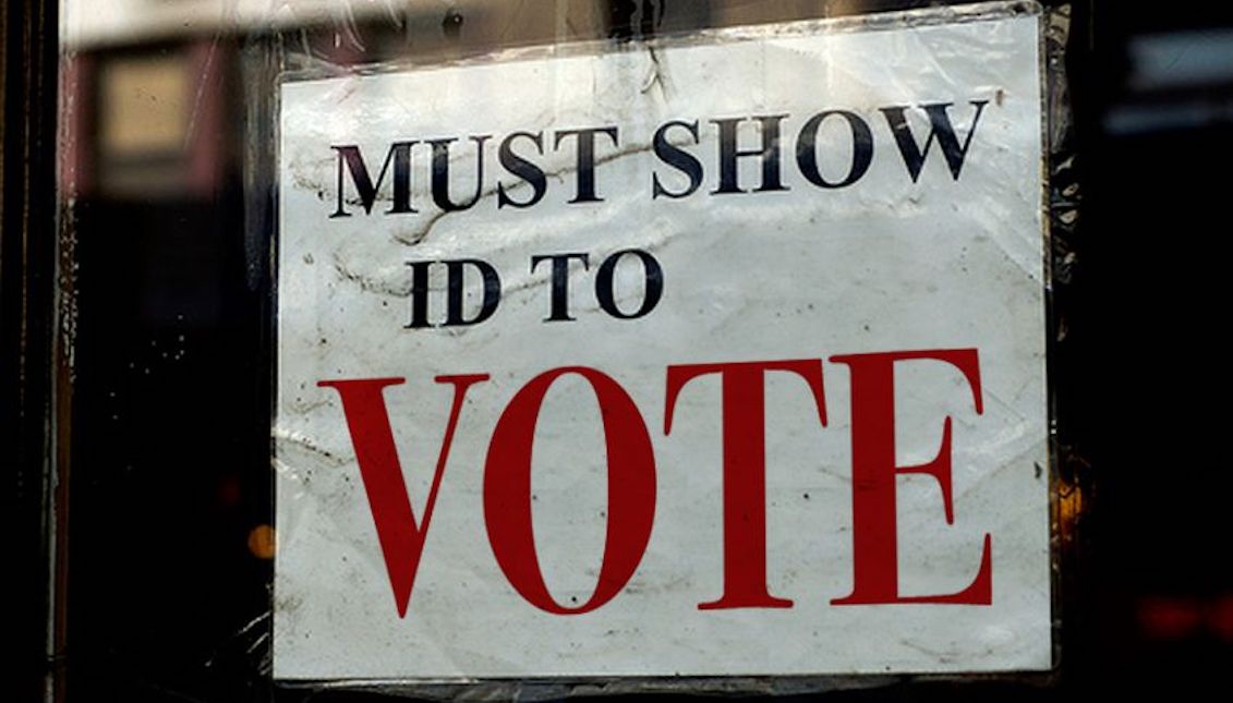 An ad warns citizens that they must present an ID to be able to vote. Photo: Todd Wiseman.