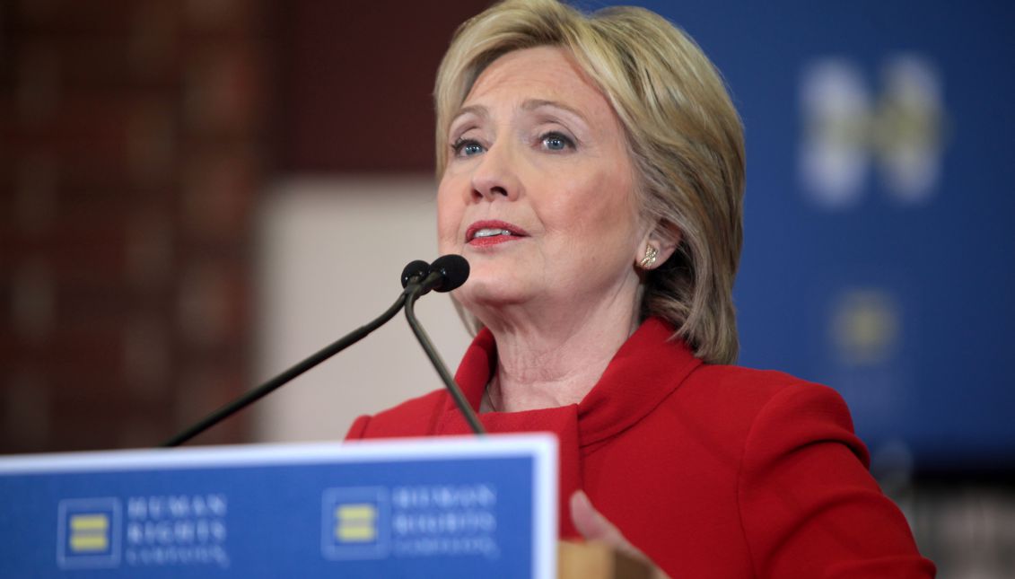 Former Secretary of State Hillary Clinton speaking with supporters at a "Get Out the Caucus" rally at Valley Southwoods Freshman High School in West Des Moines, Iowa, on 24 January 2016. Source: Wikimedia