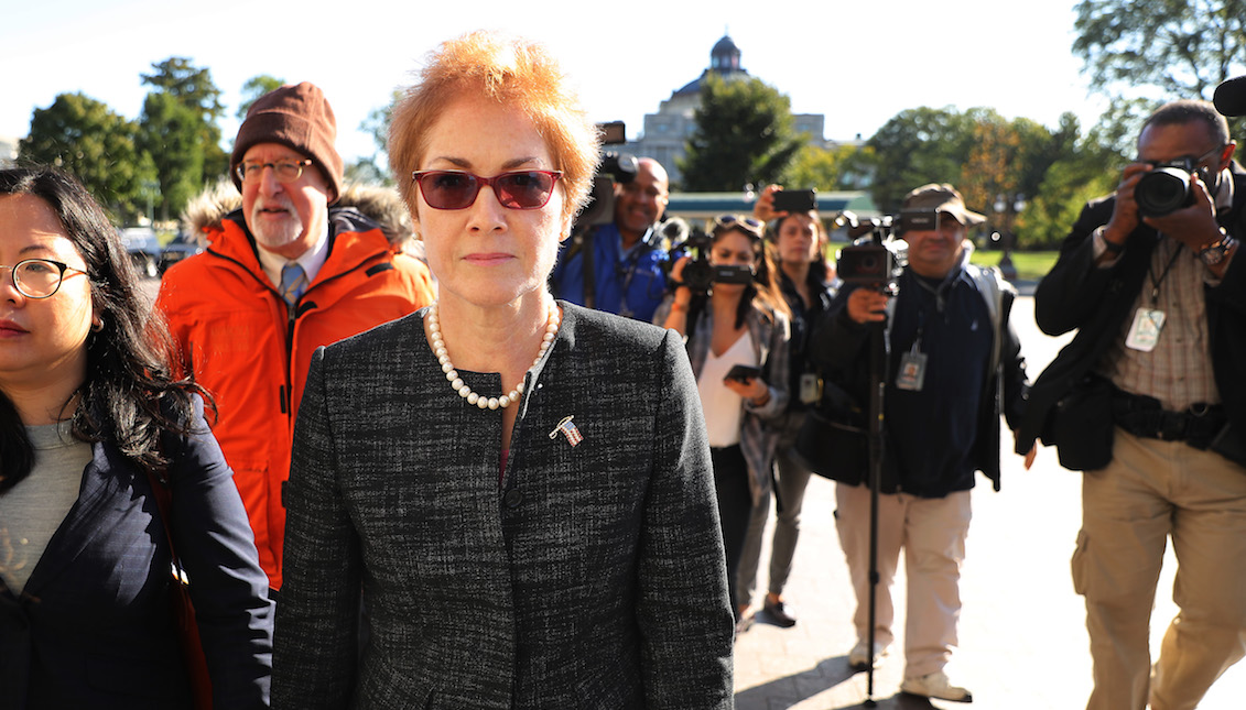 WASHINGTON, DC - OCTOBER 11: Former U.S. Ambassador to Ukraine Marie Yovanovitch (C) is surrounded by lawyers, aides and journalists as she arrives at the U.S. Capitol October 11, 2019 in Washington, DC. (Photo by Chip Somodevilla/Getty Images)