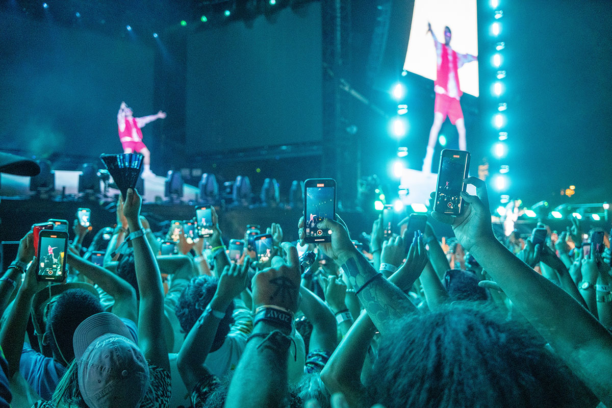 Audience records Bad Bunny performance.