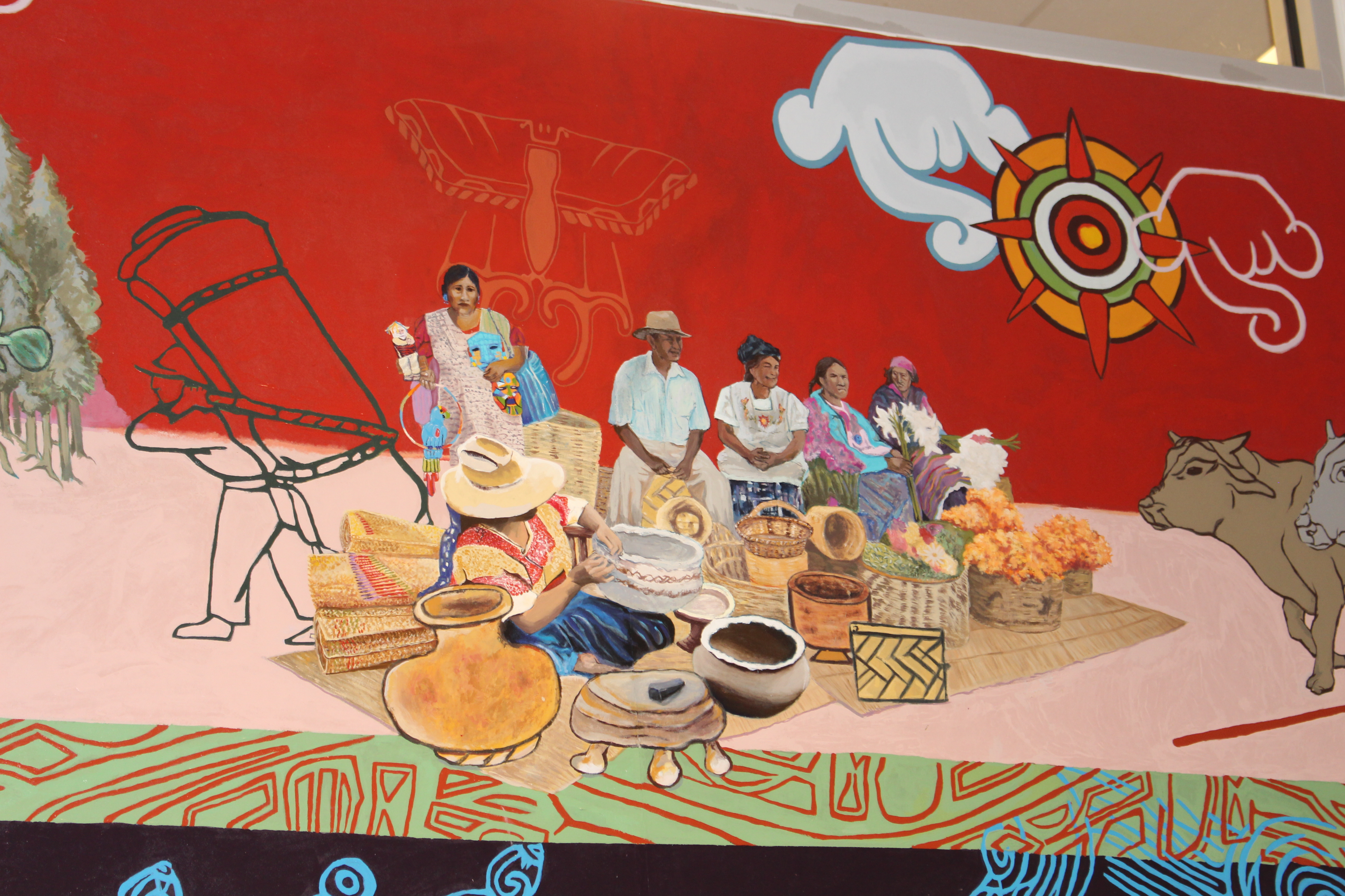 A section of the red mural, that depicts the elders. Photo credit: Emily Leopard-Davis/AL DÍA News