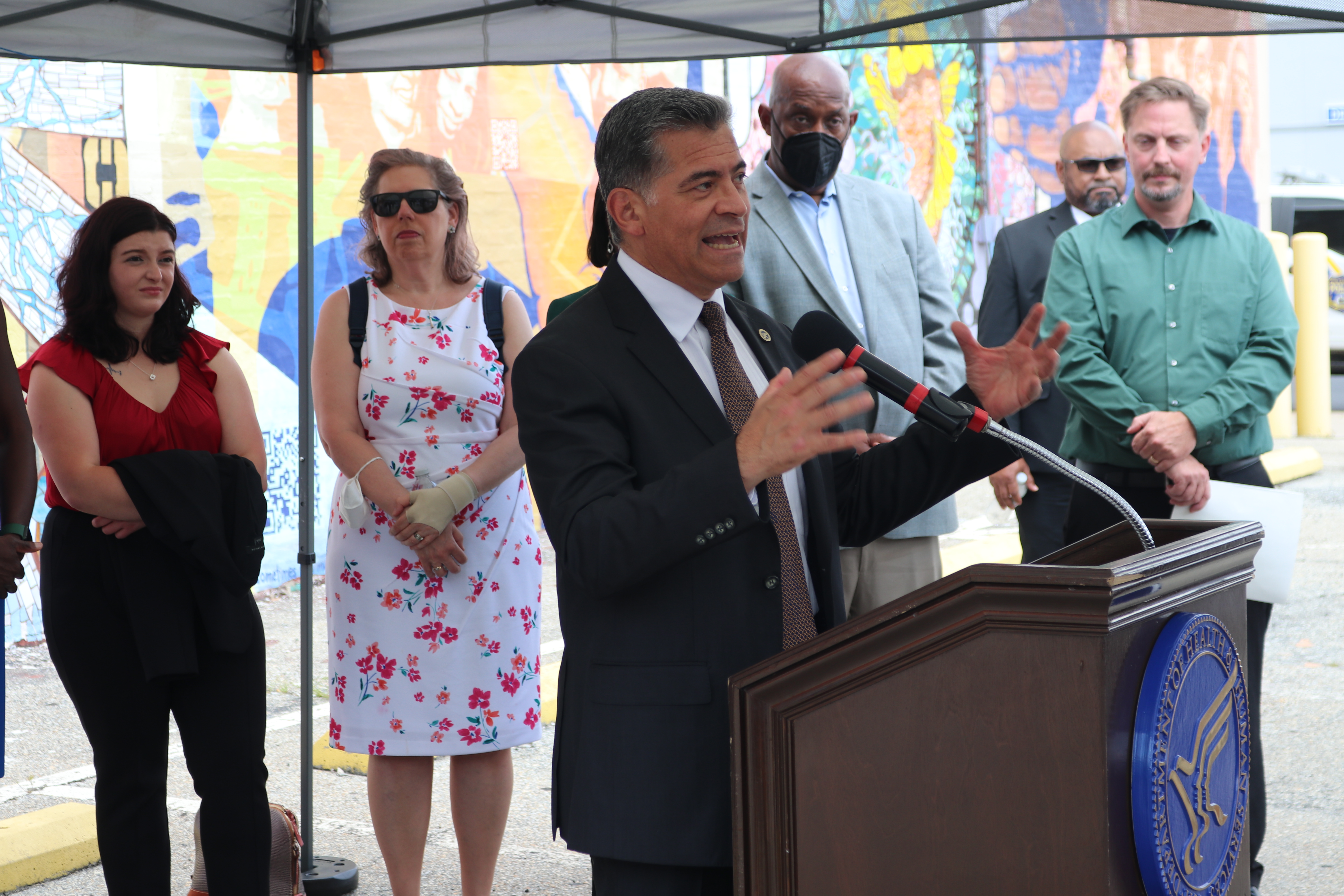 Pictured: Secretary Xavier Becerra addresses the press from the podium