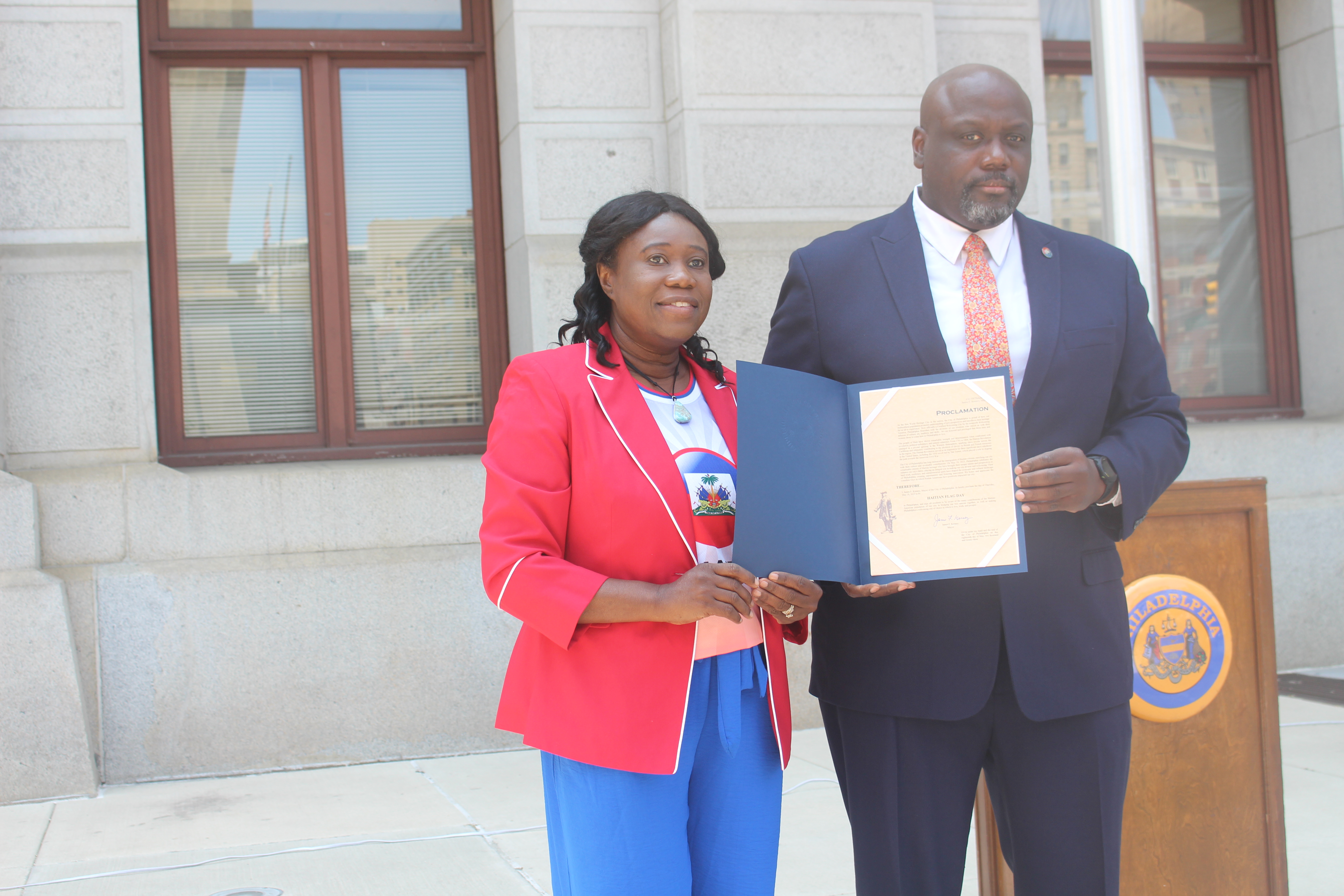 Merytony Nathan and Alain Joinville hold the Mayor's Proclamation. Photo: Jensen Toussaint/AL DÍA News.