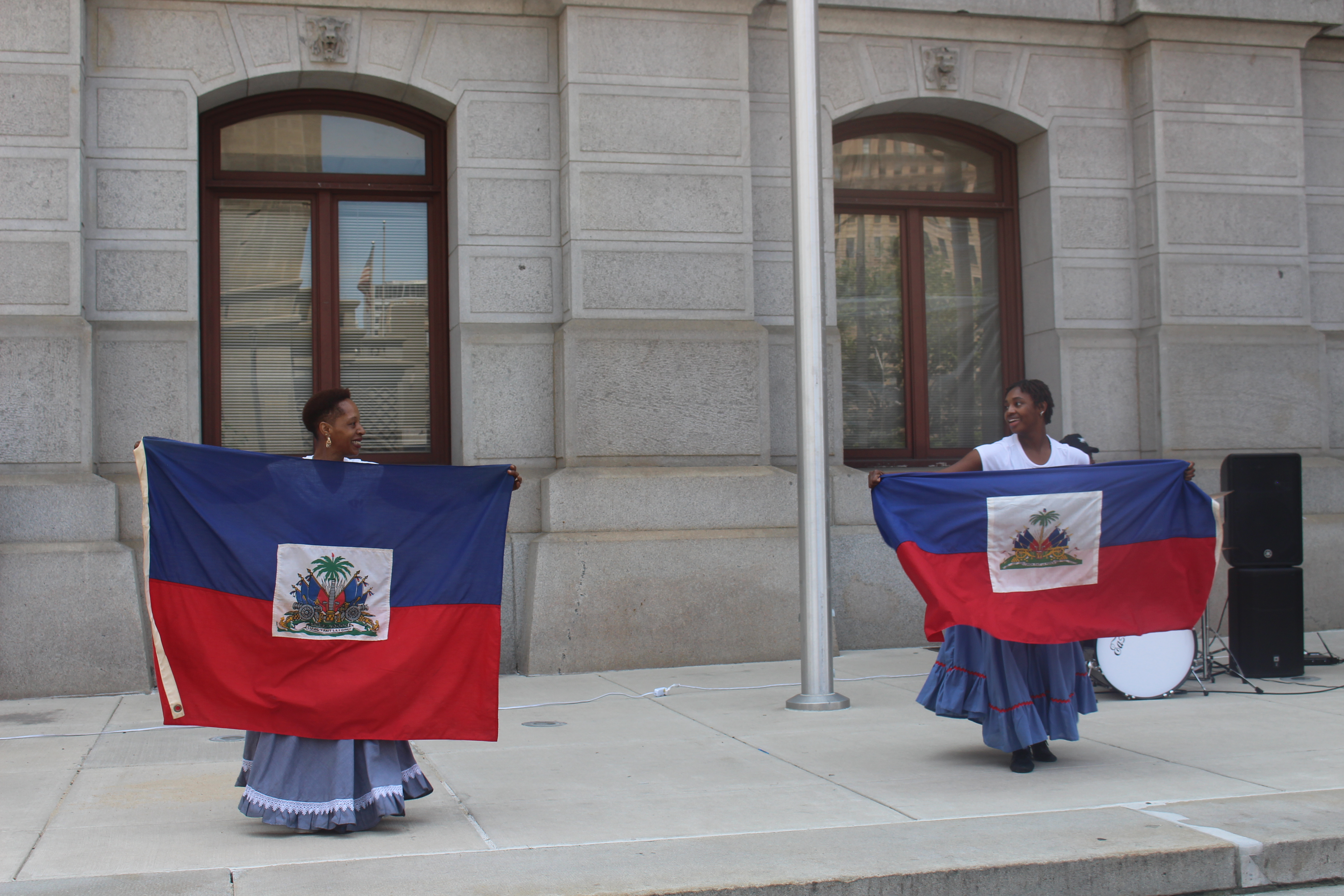 A traditional Haitian dance with Haitian flags abound to celebrate Haitian Flag Day. Photo: Jensen Toussaint/AL DÍA News.