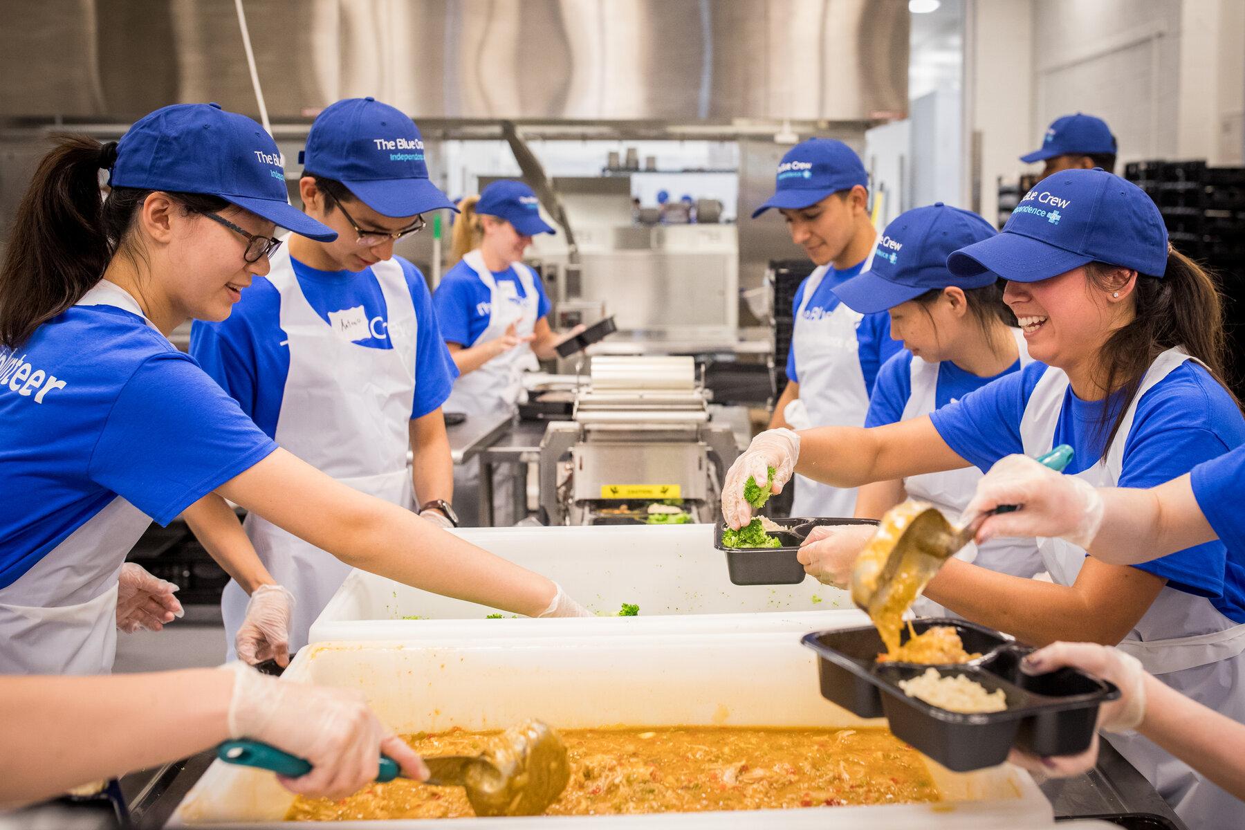 Jose and Antonio with fellow interns at Blue Crew Volunteer Event at Manna, July 9, 2018